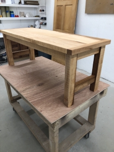 custom maple table on display in workshop